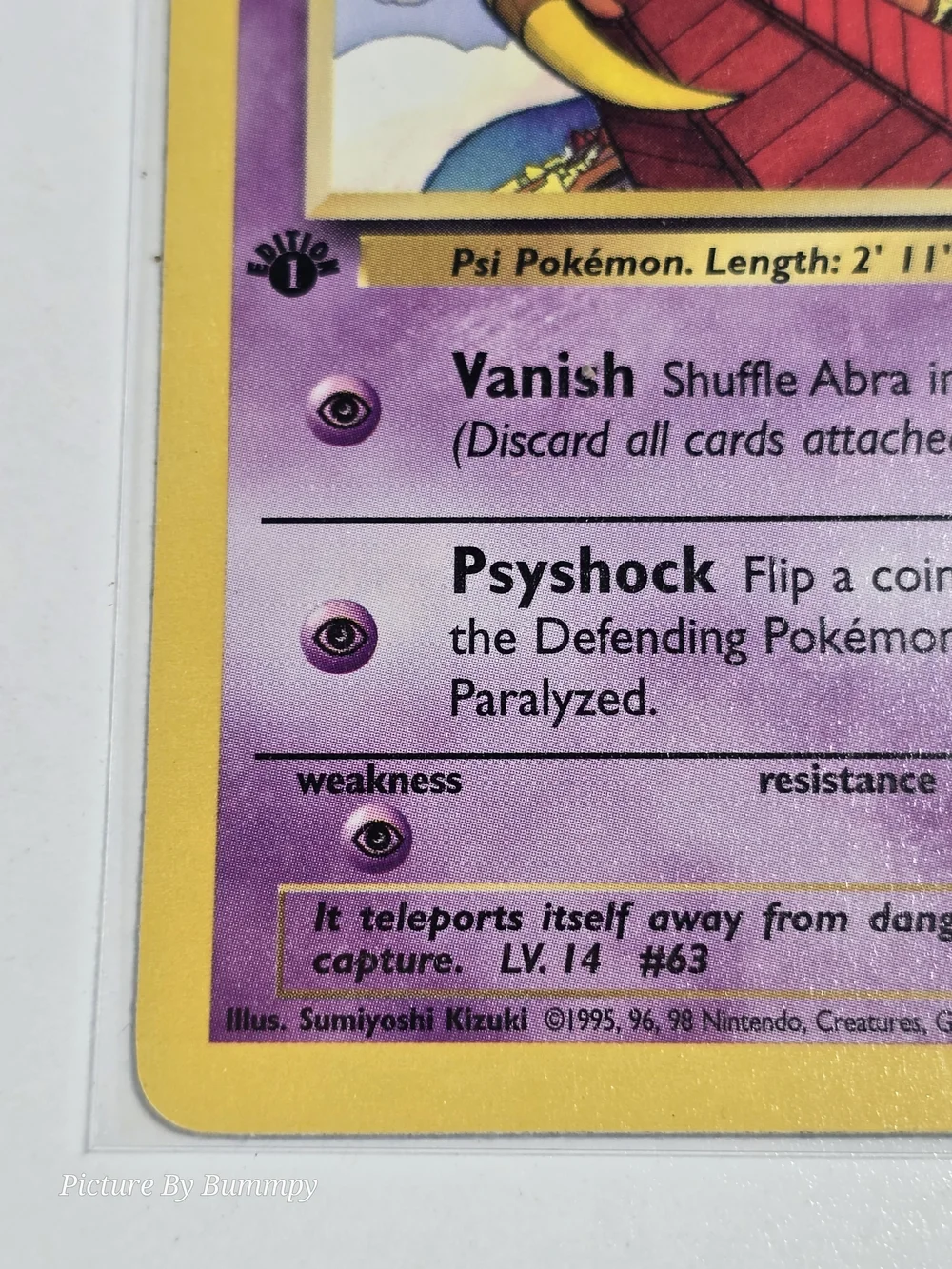 #20 Pokemon 1st Edition Abra card from the Team Rocket set, card number 49/82.